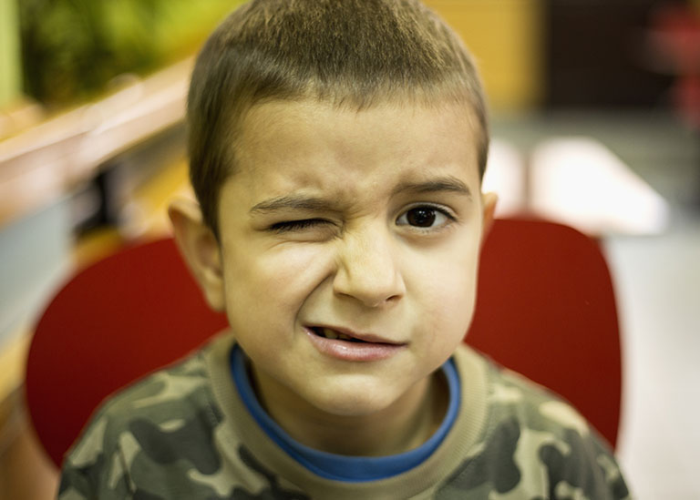 Boy with tic in eye